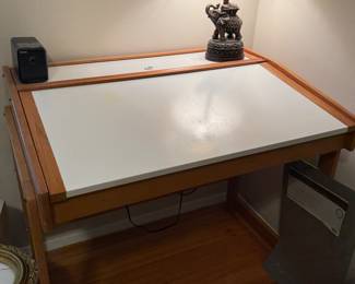 Crafting, drafting, or plotting to take over the world? Look no further than this like new desk with storage under the folding top....