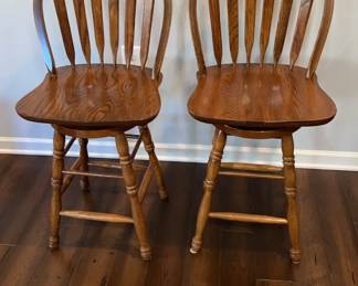 Two Tall Wood Swivel Chairs