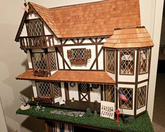 Handcrafted Doll House, fully furnished. Comes with a large bin full of more furniture and doll house crafts to create your own oasis!!