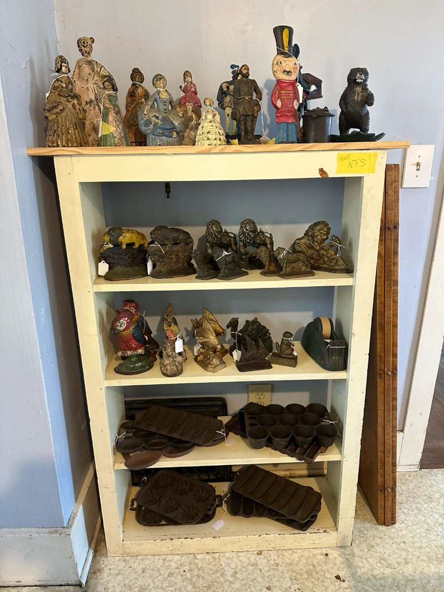 Figural Cast Iron. Lions; Parrots; Fish; Camel; Grundsow Lodsch 13 with squirrel; heavy tape dispenser; corn bread pans; popover pan; Turqs head muffin pans; Abelskiver pans.