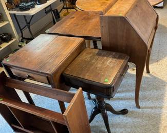 Bookshelf, maple; pedestal leg one drawer stand; dropfront ladies desk; parlor table oak; dropleaf one drawer stand.