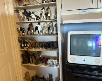 Figural doorstops: Dogs, elephants.