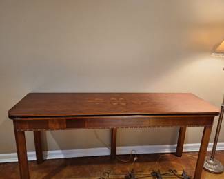 Henredon console table that opens to a dining table