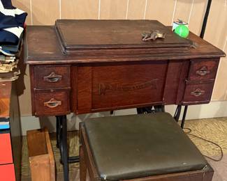 Has sewing machine in it but not the original one.  We do have the original one that will be sold with it. 