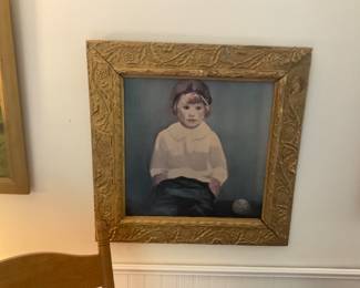 A little boy painted on board