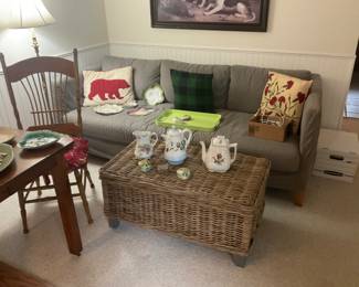 a wicker, coffee table, and a very nice sofa