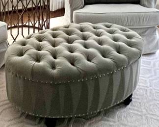 Item #49 .  Uttermost oval tufted ottoman.  Color - Gray green. H- 18 in.  W - 24 1/2 in.  L- 40 in. Great condition.  Price - $48.00