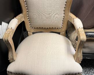 Item #45.  Pair of light wood French style arm chairs.      H- 36in. W- 36in. Seat Height - 17in.  Price - $100.00.