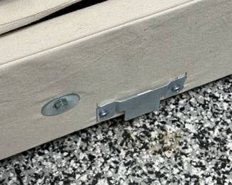 Item # 46.  Gray sectional by Simplicity Designs by Ally Whalen Interiors. Sectional is slipcovered.  Stains on slipcovers. 6 pieces with locking mechanism.  Approximately 11ft x 8ft.                    Price - $400.00.