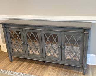 Item #2 - Gray Mirrored sideboard from Coast to Coast Imports.  Mirrored cabinet doors.  See next picture for condition of corner. L-64"  D-14"  H-34 1/4.                    Price - $160.00.