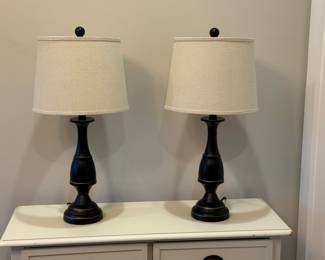 Item # 12. Pair of oil rubbed bronze lamps.  See next picture for small dent in back of lamp.  H- 25 " to top of finial. Price - $20.00