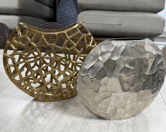 Item #56. Two metal vases.  Gold - H- 11 1/2 in.         Silver-10 1/2 in.  Price - $16.00