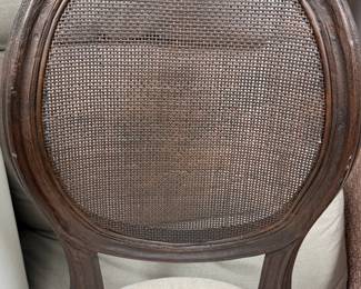 Item #40.  Set of 6 oval cane back dining chairs from Orient Express.  In espresso finish.  Some chairs show wear on cane backs.  H- 10 1/2in.  W- 19in.  Seat height - 18in.  Price - $200.00
