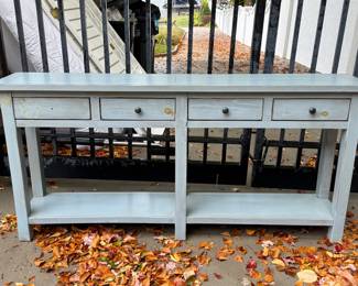 Item #27.  Slate blue 4 drawer console table. One drawer has missing drawer pull.  Wear on top as shown in following pictures.      W- 71 3'4".  D- 13 3/4".  H- 34 1/2". Price - $60.00