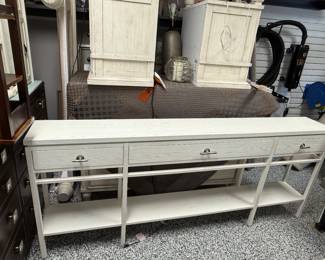Item # 14.  Stanley Furniture Co.  Cream console.  Cream white wash finish. Shows some discoloration on top from lamps.    L- 84" D- m 11 1/2 "  H- 34 1/2". Price $300.00.