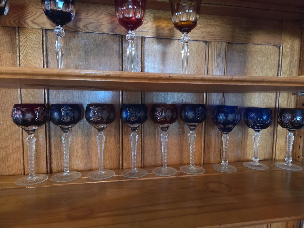 Hand carved  Belgian Crystal wine glasses in Blue red and green and a few yellow