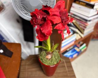 Faux flowers, oscillating fan and side table
