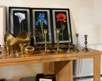 brass candlesticks and wall art
