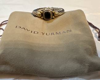Large David Yurman


This is a David Yurman Classic Cable Bracelet in sterling silver with 14k yellow gold and black onyx. 
