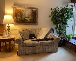 Vintage Loveseat, Faux Plants, Wooden Side Table, Framed Art
