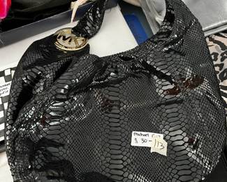 #113	Michael Kors Black Patent Leather Bag	 $30.00