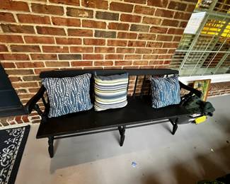 #181	black wood bench with blue pillows 	 $125.00