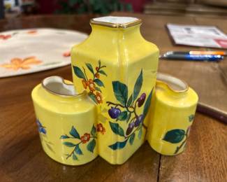 Vintage Italian Hand-Painted 3-Tube Bud Vase (Italy, 1970s–1980s). Picture 1 of 2. 
Colorful Italian ceramic bud vase featuring three joined tubes with hand-painted fruiting branches on a vibrant yellow background. Gold-trimmed rims and unique sculptural form. Marked “Italy” on the underside. Excellent accent piece for curios, kitchen décor, or cottage displays.
Very good vintage condition with light age wear.
Price: $34