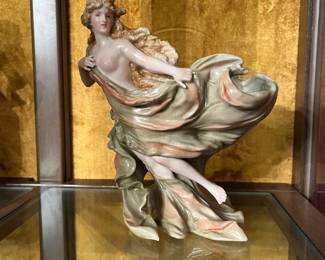 Antique Dresden Art Nouveau Porcelain Figurine (c.1890–1920). Picture 1 of 2.
Beautiful hand-painted German porcelain figurine featuring a flowing draped Art Nouveau maiden with wind-swept hair. Underglaze Dresden mark and impressed mold numbers on underside. Excellent detail and movement. Fine display condition.  
Price: $150