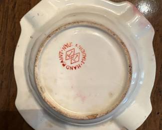 Vintage Hand-Painted Porcelain Ashtray (Japan, 1950s). Picture 2 of 2. 
Vintage porcelain ashtray featuring hand-painted rose florals, gold scroll accents, and scalloped edges. Marked “Hand Paint, Made in Japan” on underside. Classic mid-century collectible smoking accessory.
Good vintage condition with light age wear and glaze crazing.
Price:  $10