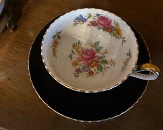 Vintage Black & Gold Porcelain Cabinet Cup & Saucer
(Picture 1 of 2)
Elegant vintage porcelain tea cup and saucer with onyx-black ground and colorful floral bouquets. Gold scalloped rim and gilt handle add a classic European touch. Bright patterning and excellent display appeal — perfect for curio cabinets, cottage décor, and collector shelves.
Very good vintage condition.
Price: $28 or BO