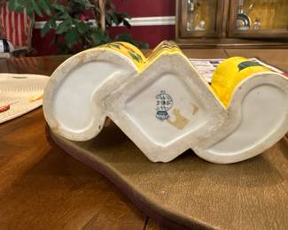 Vintage Italian Hand-Painted 3-Tube Bud Vase (Italy, 1970s–1980s). Picture 2 of 2. 
Colorful Italian ceramic bud vase featuring three joined tubes with hand-painted fruiting branches on a vibrant yellow background. Gold-trimmed rims and unique sculptural form. Marked “Italy” on the underside. Excellent accent piece for curios, kitchen décor, or cottage displays.
Very good vintage condition with light age wear.
Price: $34