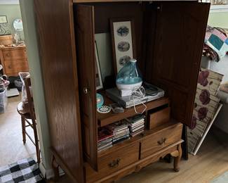 Cabinet for electronics or storage. Feeling crafty? Repurpose it into a closet for children’s clothing or bedding.