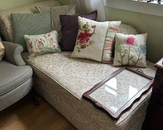 A lovely fainting couch that appears to be nearly unused.