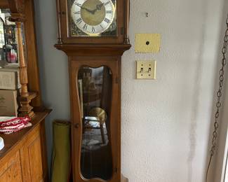 A slim grandfather clock.