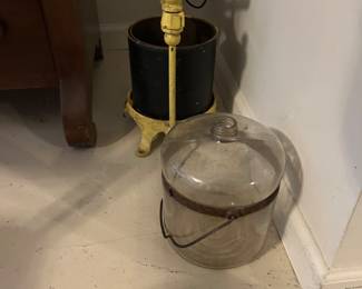 A kerosene jug and lard press.