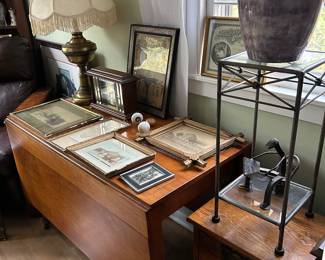 Pictures, pottery, small metal table and metal figure.