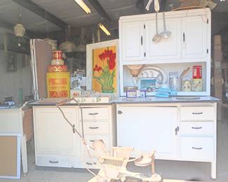 Vintage cabinet with built in flour sifter and icebox under pull out enamel counter top. Upper storage cabinet and drawers.
Smaller unit with icebox, drawers and enamel counter top.