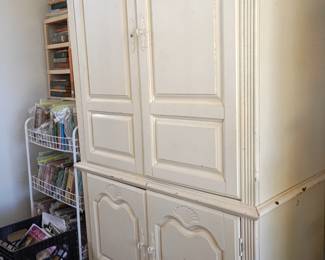 Antique white television cabinet.