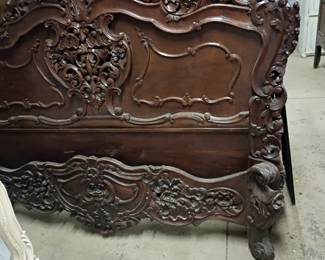 Highly carved antique Baroque style bed frame.