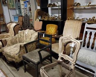 Assorted chairs, end tables, decorative items.