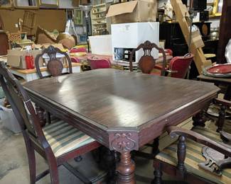 Cottage era table with coordinating chairs.