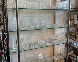 Assorted crystal 65% off + tax, glass shelving unit $350 + tax.