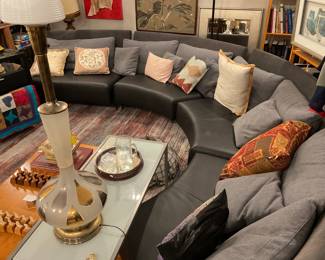 Curved leather and cloth sectional sofa $2100 + tax (depth=35” height of seat=14” height of back=30” length of each section=58”)