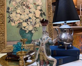 artwork, old Christmas figurine, silver teapot lamp, brass chargers and small candlesticks, MCM glass grapes