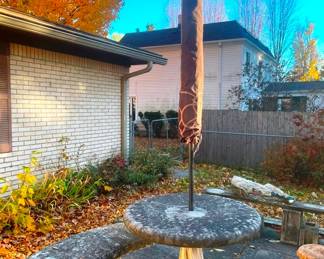 Concrete table with two benches and unbrella