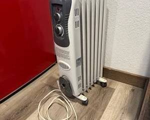 DeLonghi White Oil Filled Radiator Heater with Thermostat Control and Wheels
