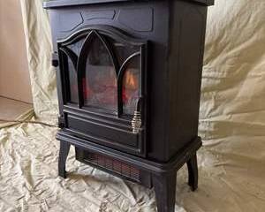 Black Electric Fireplace Heater with Ember Glow and Gothic-Style Glass Door
