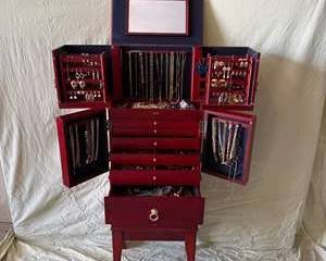 Vintage Red Wooden Jewelry Armoire with Multiple Drawers, Necklace Hooks, and Mirror Filled with Jewelry