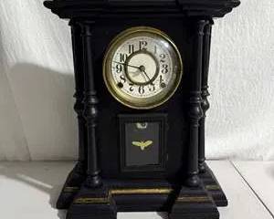 Antique Black Mantel Clock with Gold Accents and White Dial