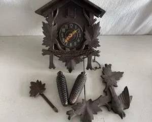 Classic Wooden Black Forest Style Cuckoo Clock with Leaf and Bird Carvings and Pinecone Weights